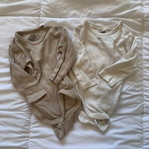H&M neutral baby onesies.
